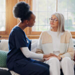 Mature, sad woman or caregiver with empathy or results in consultation for bad news or cancer disea.