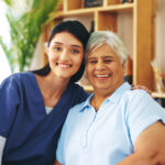 Nurse, elderly woman and portrait with happiness in lounge for medicine, trust and assisted living